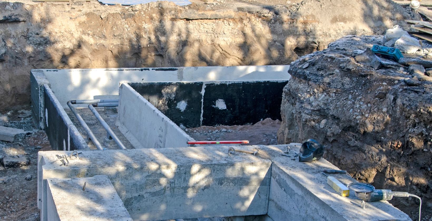 Underground Gas Pipework Installation | PE, Steel & Copper Excavated trench with concrete ducting and underground service pipework under construction